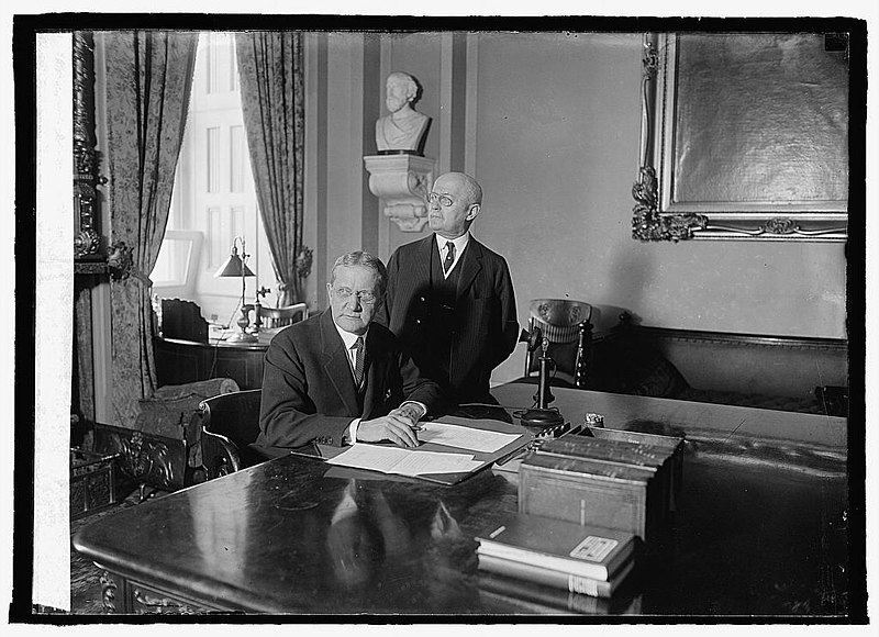 File:Sen. Geo. H. Moses (sitting), Geo. A. Sanderson, Secty. of Senate (standing), 3-25-24 LCCN2016848852.jpg