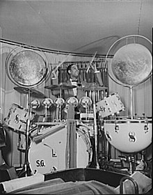 Image of Sonny Greer with his drum set, which included timpani among other accessories Sonny Greer 1943.jpg