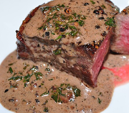 Steak au poivre prepared with filet mignon