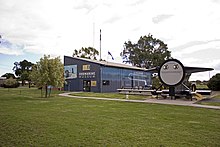 Otway's stern section on display next to the Holbrook Submarine Museum; both located near Otway's landlocked location Submarine Museum and the HMAS Otway's 'Ducks Arse' in Germanton Park.jpg