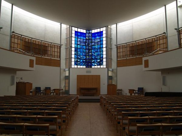 The interior of the chapel, showing John Clark's stained glass memorial window (centre)