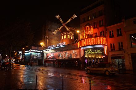 The Moulin Rouge at night in rain