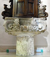 Capitello ionico-italico da un tempio romano del III-II secolo a.C., attualmente reimpiegato come base del fonte battesimale nella chiesa di Santa Maria Assunta