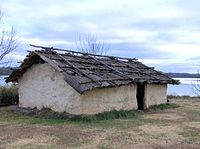 Reconstruction of a typical Tuskegee Village dwelling at Fort Loudoun State Park, near Vonore, Tennessee. The original site of Tuskegee is now under the lake in the background. Tuskegeevillagedwelling.jpg