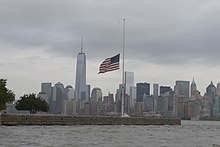 The United States flag flying at half-staff in memorial of the September 11 attacks in New York City, Sep. 11 2014. US Coast Guard photo 140911-G-ZV332-011 Ellis Island American flag honors 9 11 victims.jpg