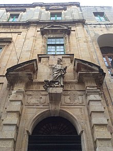 Entrance of the Old University Building with a statue of St Ignatius of Loyola and defaced coats of arms Valletta VLT 06.jpg