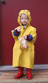 A child wearing a yellow raincoat with hood Yellow Raincoat.jpg
