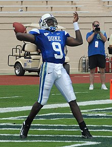 Lewis throwing a pass against Connecticut in Duke's 2007 opener. 2007 Thaddeus Lewis passing vs UConn cropped.jpg