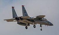 A US Air Force F-15C Eagle, tail number 83-0011, on final approach at Kadena Air Base in Okinawa, Japan. The aircraft is assigned to the 67th Fighter Squadron.