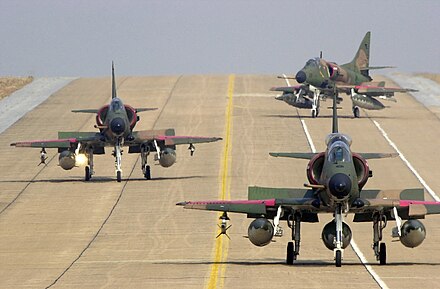 One TA-4SU leading Two A-4SU Super Skyhawks on the flight line at Korat AB, Thailand, during Exercise Cope Tiger '02.
