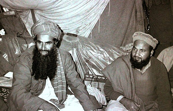 Sayyaf (left) as an Afghan Mujahid commander in 1984