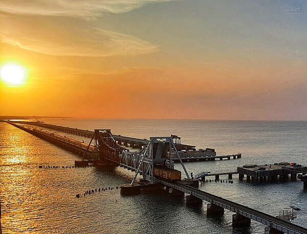 Image: A Magnificient Evening Sunset With Pamban Railway Bridge and Boat Mail Express Passes Through this Pamban Railway Bridge ! 