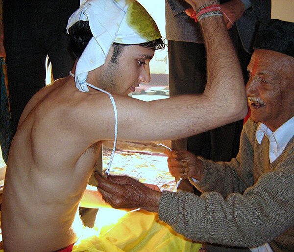 The Upanayana ceremony in progress in Nepal. Traditionally, this ritual was for 7, 9, and 11 year olds in South Asia, but is now practiced for all age