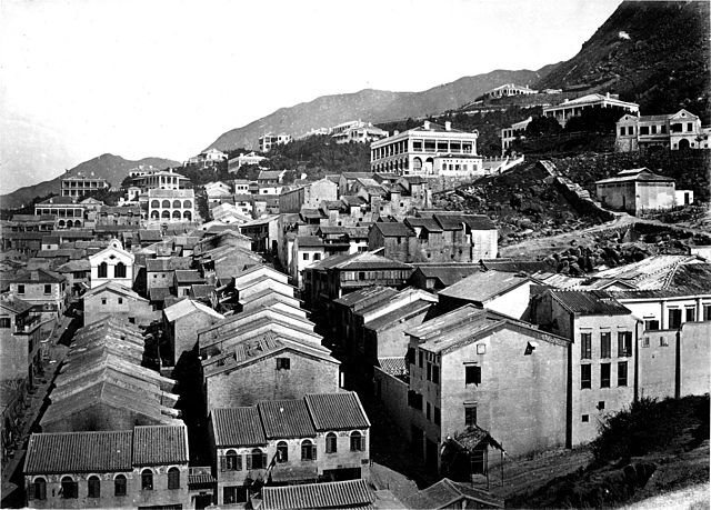 19th-century tong lau in Tai Ping Shan in Hong Kong. The terraced buildings used by the Chinese in the foreground are distinct from the larger buildin