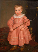 Niño estadounidense con vestido de color rosa antiguo, según la moda de 1840.