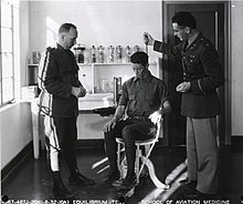 Equilibrium test being administered to prospective pilot, via Barany chair Barany Chair equilibrium test.jpg