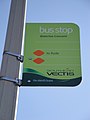 The bus stop flag at Waterloo Crescent, Binstead, Isle of Wight. At the time of photographing it served Southern Vectis' Binstead and Haylands shuttle service until it was replaced by regular route 37 on 18 April 2010. The old number 4 has been taken off and the sticker for what was route 29 also removed.
