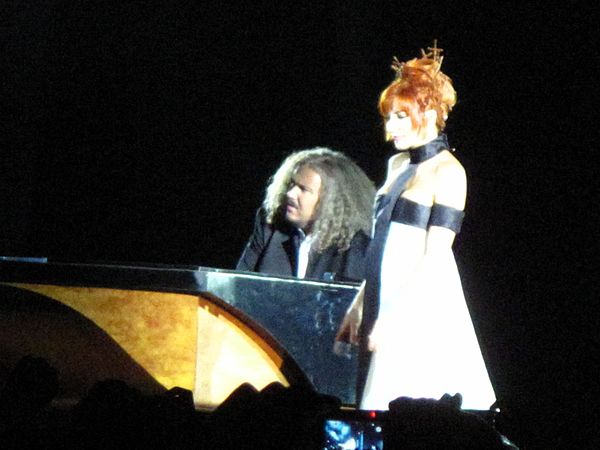 Farmer on stage at Stade de France during her 2009 concert tour.