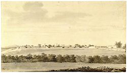 A distant fort atop a low hill. In the foreground, extending from left to right, is a field or a body of water. A stand of trees separate it from the hill.