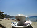 Coffee cup and beach, Cefalú, Sicily, Italy (9452453092).jpg