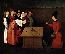 The Conjurer, painted by Hieronymus Bosch. The painting accurately displays a performer doing the cups and balls routine, which has been practiced since Egyptian times. The shell game does have some origins in this old trick. The real trick of this painting is the pickpocket who is working for the conjurer. The pickpocket is robbing the spectator who is bent over. Conjurer Bosch.jpg