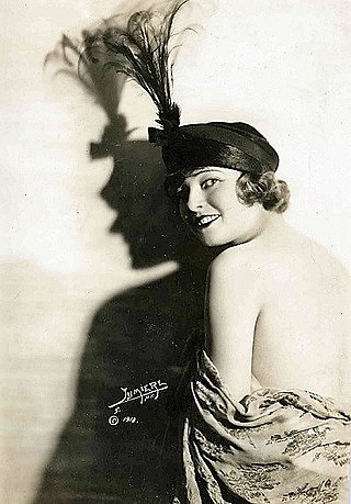 Woman with feather hat, looking over shoulder