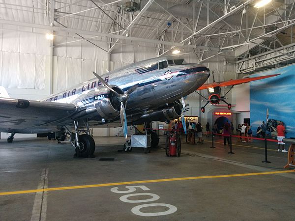 Delta Ship 41 in Historic Hangar 1, with the Stinson Reliant in the background