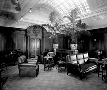 Orama's first class smoking room in 1911, with glazed barrel-vaulted ceiling and Dutch colonial style panelling and plasterwork First Class Smoking Room on the 'Orama' (1911) RMG G10665.tiff