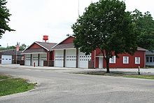 Fisher fire station and water tower, June 2007 Fisher Illinois fire station and water tower.jpg