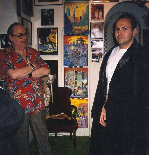 File:Forrest J. Ackerman, collector of movie memorabilia, with fan..jpg