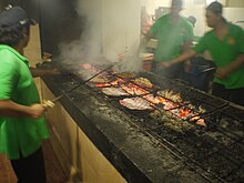 Grilling fish in Jimbaran, Bali. Grilling fish in Jimbaran.jpg