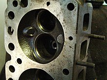 Chrysler Hemi 265ci 6-cylinder hemispherical combustion chambers with large intake and exhaust valves (removed) and big square ports HEMI 265ci 6 cylinder combustion chamber.JPG