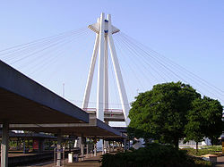 Railway station with elevated highway in background