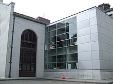 Hearst Mining building clad in stone on the left, with extension on the right covered in shot peened aluminum alloy Hearst memorial mining building.jpg