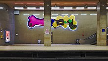 Joséphine-Charlotte metro station platform, facing "Les oiseaux émerveillés" by Serge Vandercam in (Woluwe-Saint-Lambert, Belgium).jpg