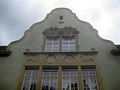 Fassade des Verwaltungsgebäudes des ehemaligen Schlachthofs in Stuttgart, heute Schweinemuseum und Gasthaus, mit bildhauerischem Schmuck von de:Josef Zeitler, 1902, Stuttgart, Schlachthofstraße 2.