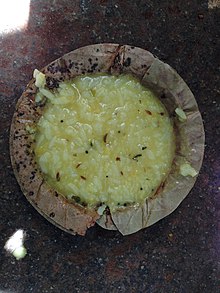 Khichdi is an Indian dish. This image shows a prasada in a traditional areca leaf bowl at ISKCON Temple Bangalore. Khichdi Prasadam in Donna (Iskcon Bangalore).jpg
