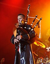 Konan Mevel, bagpiper of Tri Yann (band from Nantes) Konan Mevel Aymon Folk Festival.jpg