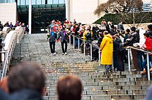 A newly married couple leaving Seattle City Hall is greeted by well-wishers on the first day same-sex marriages are celebrated in Washington state. Leaving Seattle City Hall on first day of gay marriage in Washington.jpg