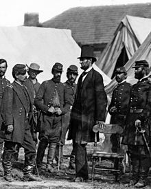 Abraham Lincoln, the 16th president who successfully preserved the Union during the American Civil War, with Union Army general George B. McClellan and soldiers at Antietam on October 3, 1862 Lincoln O-62 by Gardner, 1862-crop.jpg