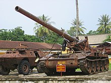 M-107 howitzer and V-100 armoured car at the Hue military museum.jpg