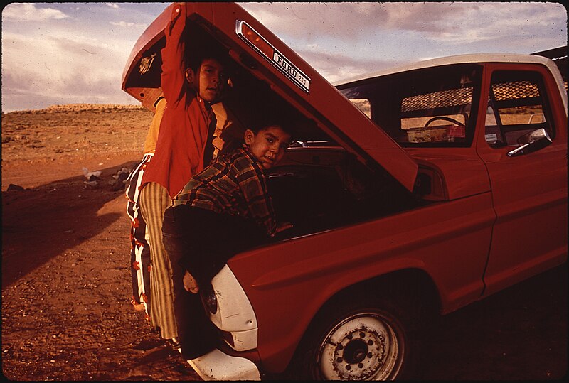 File:NAVAJO CHILDREN EXAMINE THEIR FAMILY PICK-UP TRUCK - NARA - 544402.jpg