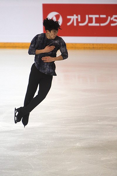 American skater Nathan Chen performing a quad jump during his free skate at the 2018 Internationaux de France.