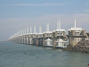 Eastern Scheldt storm surge barrier. The Delta Works and the Zuiderzee Works have been declared one of the Seven Wonders of the Modern World by the American Society of Civil Engineers. Oosterscheldekering-pohled.jpg