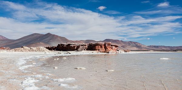 Piedras Rojas (in English "Red Stones"), a singular rock formation in the Aguas Calientes salt flat, high puna of northern Chilean Andes.