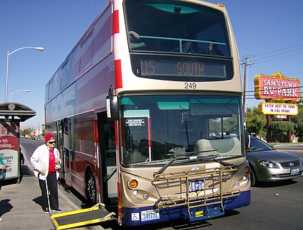 An Original 200 Series Deuce bus on the Nellis route 115 loading a wheelchair.