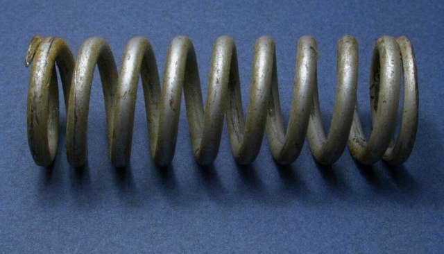 A heavy-duty coil spring designed for compression and tension
