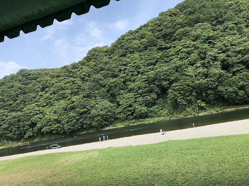 File:River in Japan with a forested hill behind it.jpg