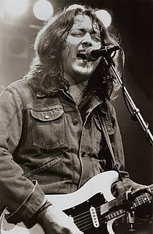 Gallagher performing at the Manchester Apollo in 1982
