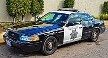 Black-and-white second generation Ford Crown Victoria Police Interceptor in 2015 Sheriff San Diego County (23822664312).jpg